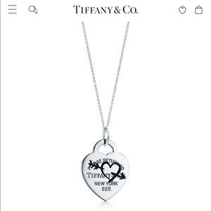 Tiffany & Co. Etched Heart and Arrow Tag Charm.